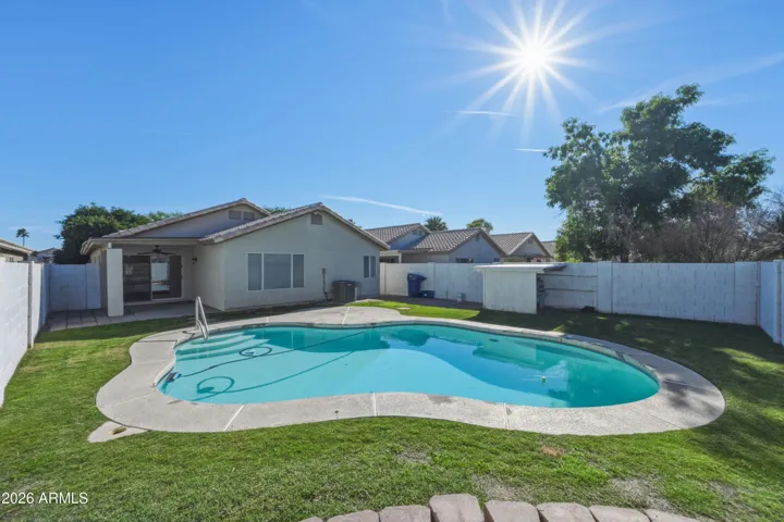 Grassy yard, covered north-facing patio, plenty of space for sunbathing & a grab rail for safety.