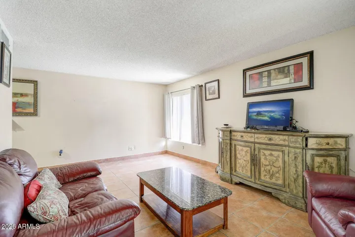 As you tour this home, you'll see the Family room currently being used as a 4th bedroom.
