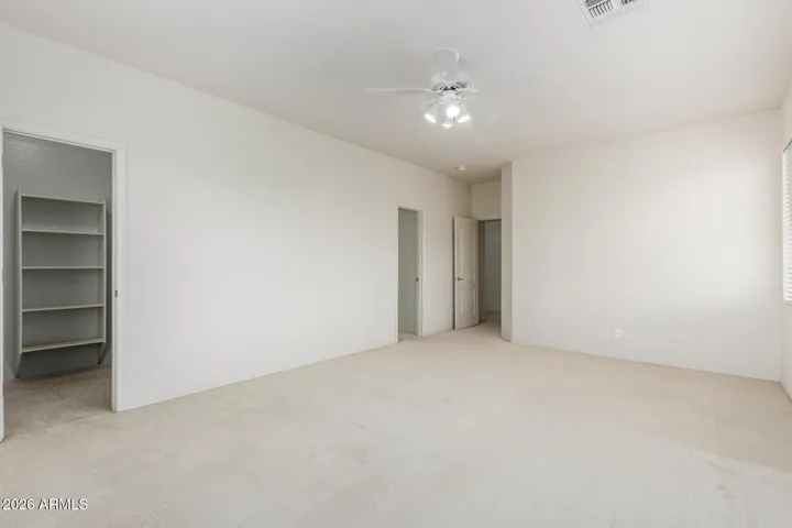Second large upstairs bedroom with walk-in closet which has entrance to dual-access bathroom.