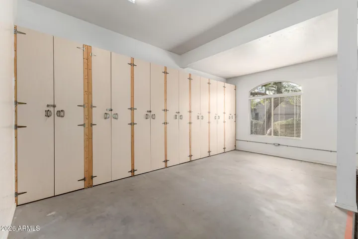 Laundry room leads you out to 3 Car Garage and extra stall, with built in storage.