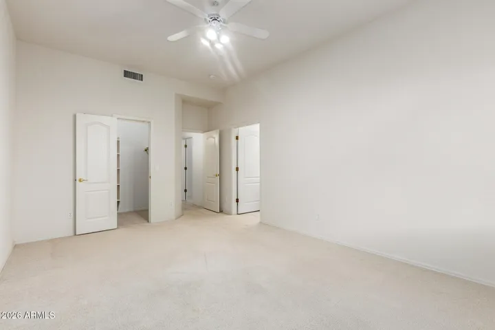Fifth downstairs bedroom with walk-in closet and it's own full bathroom.