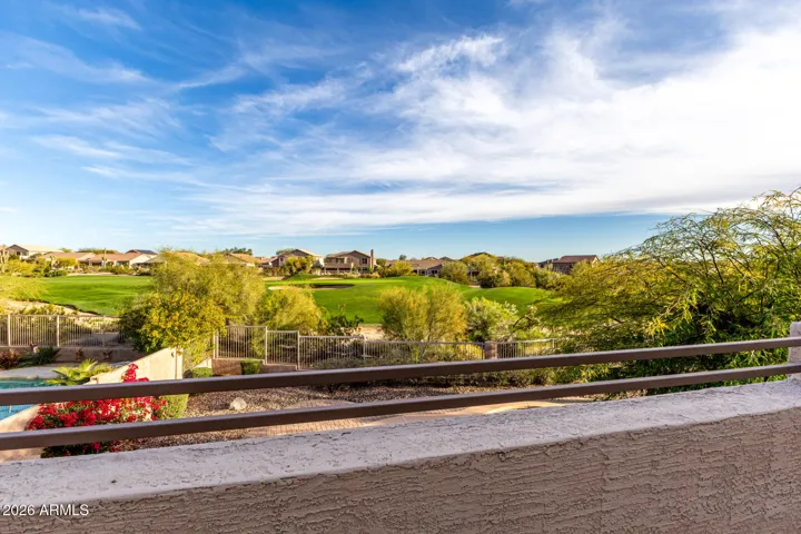 Incredible view of green on the golf course from the primary bedroom upper balcony.