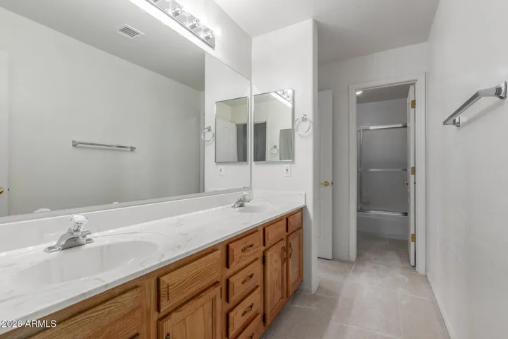 Dual-access full bathroom.