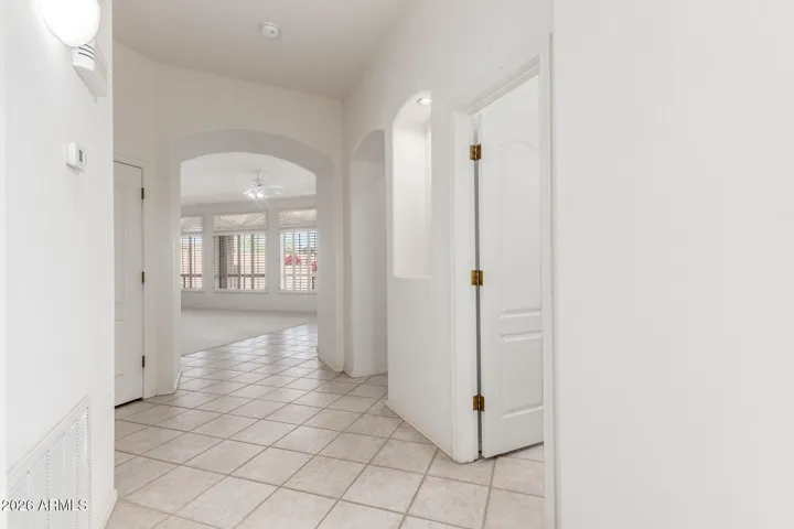 Front hallway to half bath, kitchen and main living room. Turn left to laundry room and downstairs en suite bedroom.