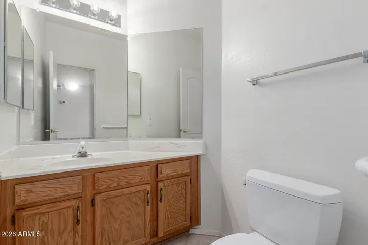 Half bath off downstairs hallway.
