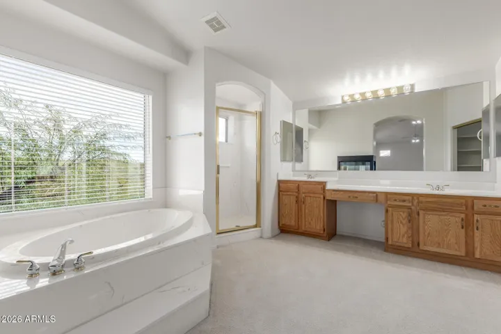 Primary bathroom. Large soaking tub. Dual vanity sinks and seperate shower.