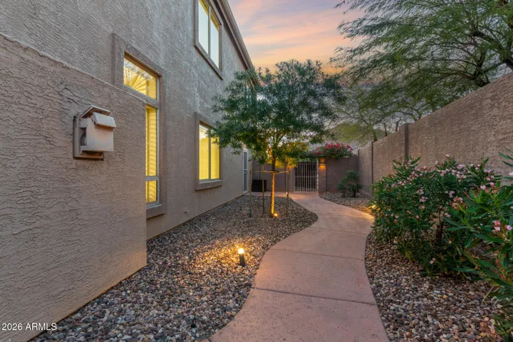Side yard. Garage access, and gate to front of home.