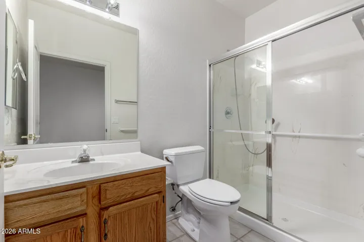 Fifth bedroom downstairs en suite full bathroom.