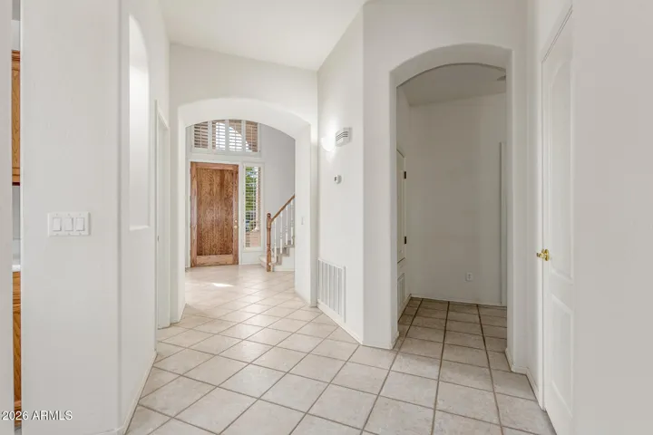 Front door hallway to half bath, kithchen, main living room and back bedroom suite and seperate laundry room with access to garage.