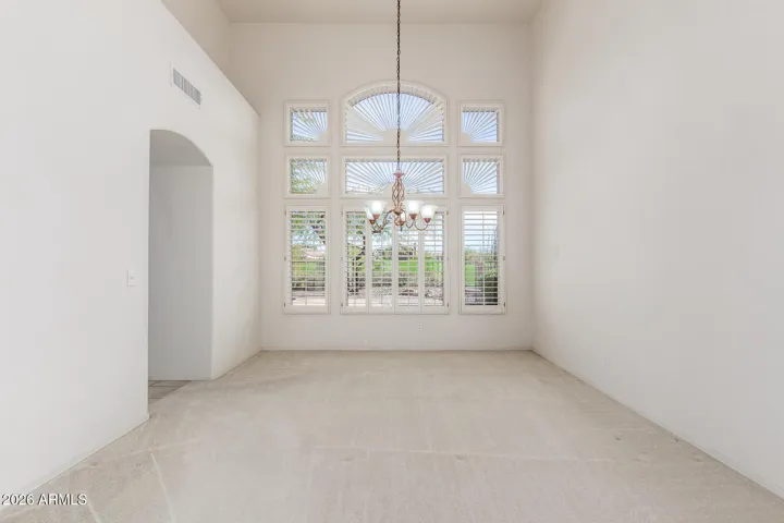 Dining room off front living space with walkway to kitchen.