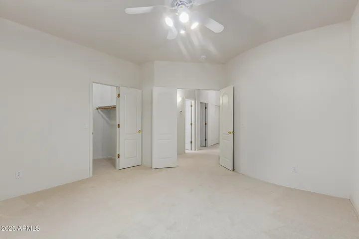 View from patio doors of first upstair bedroom with walk-in closet.
