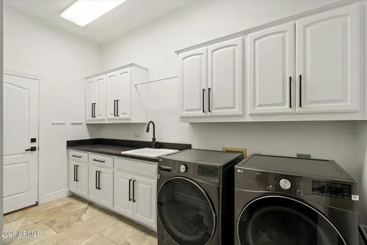 Laundry room with sink and tons of storage