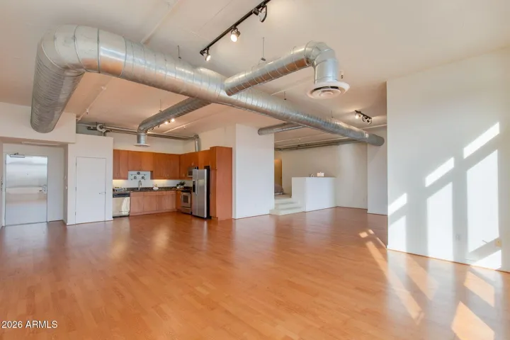 This stunning loft space offers a generous open concept living space with tons of natural lights and vaulted ceilings.