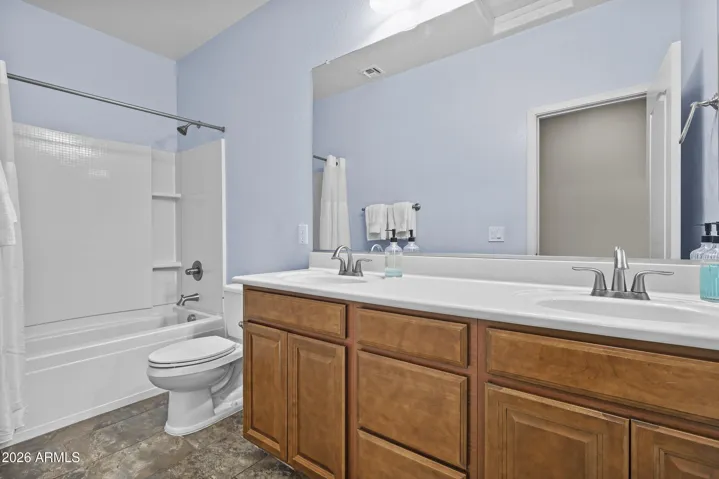 Upstairs bath with double sinks, tub/shower combo