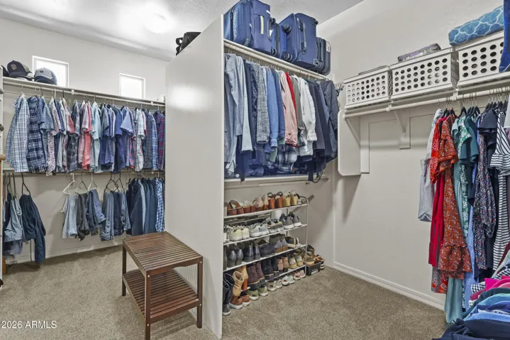 Large walk in closet with access to the laundry room!