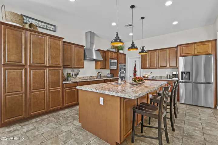 Kitchen has plenty of storage, the island has cabinets, stainless steel appliances, large pantry and more
