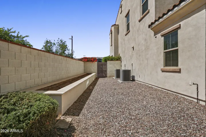 Large sideyard with planter area.