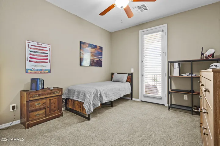 2bd bedroom upstairs, with walk in closet and door to the balcony.