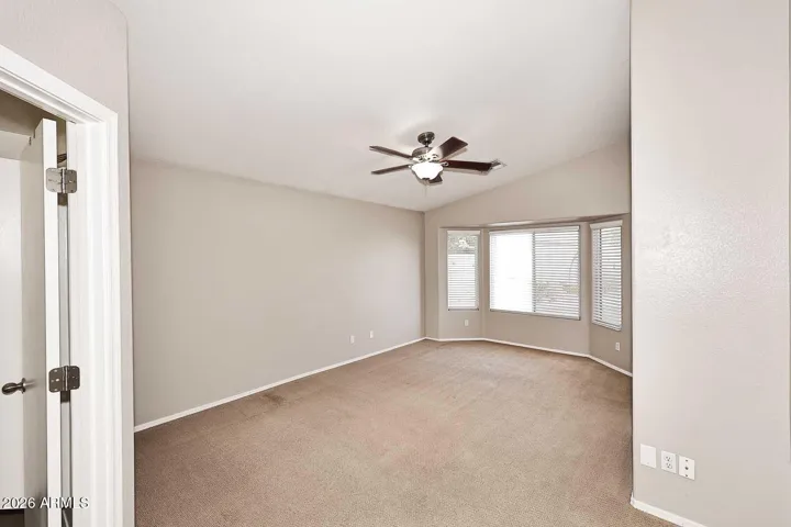 Large walk-in closet and lovely bay window with views out to the pool.