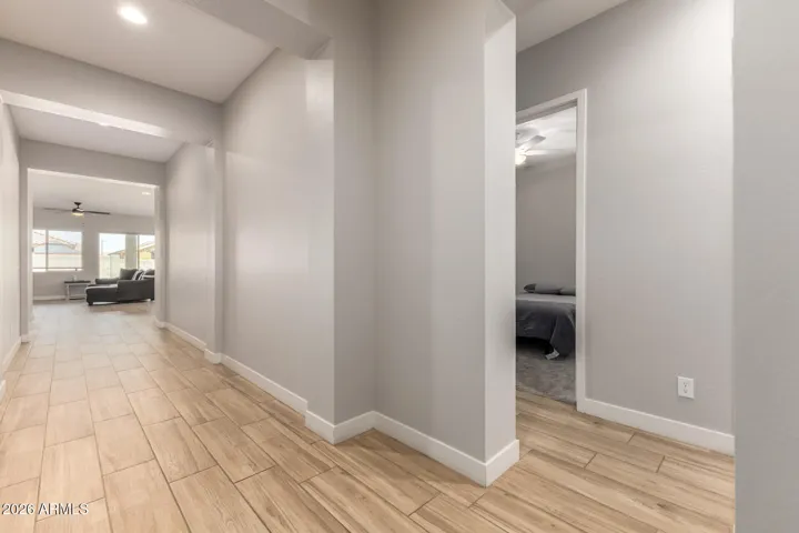 Welcoming entry hallway with wide layout, high ceilings, and modern flooring, creating an open and airy feel throughout this Surprise home.