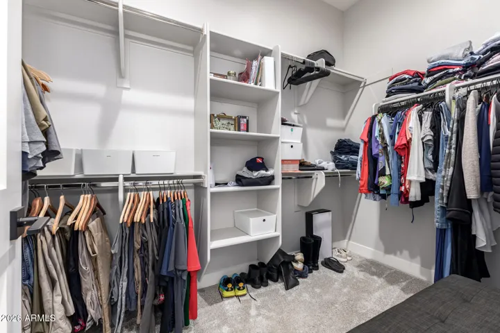 Master closet with plenty of shelving and room to hang your clothes.