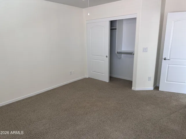 3rd bedroom looking towards closet and entry