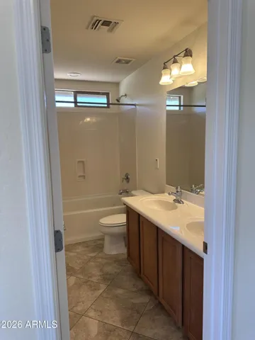 Hall bath upstairs with tub/shower combo and double sinks