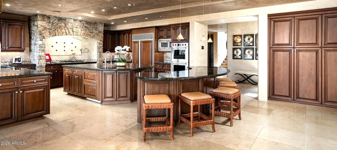 Guest counter seating with stylish cabintry pantry