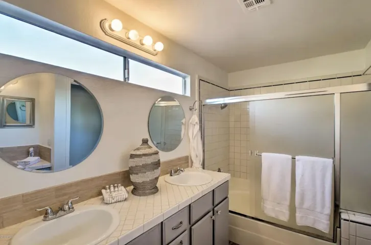 The primary bath also includes a separate makeup nook with chair.