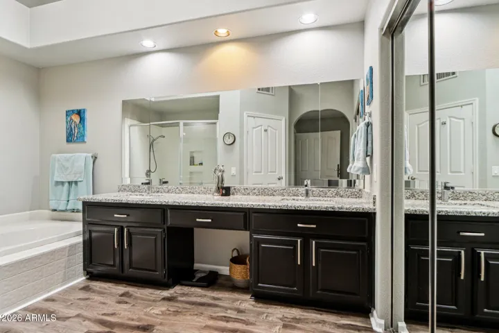 Dual sinks, separate shower / tub with a private toilet room