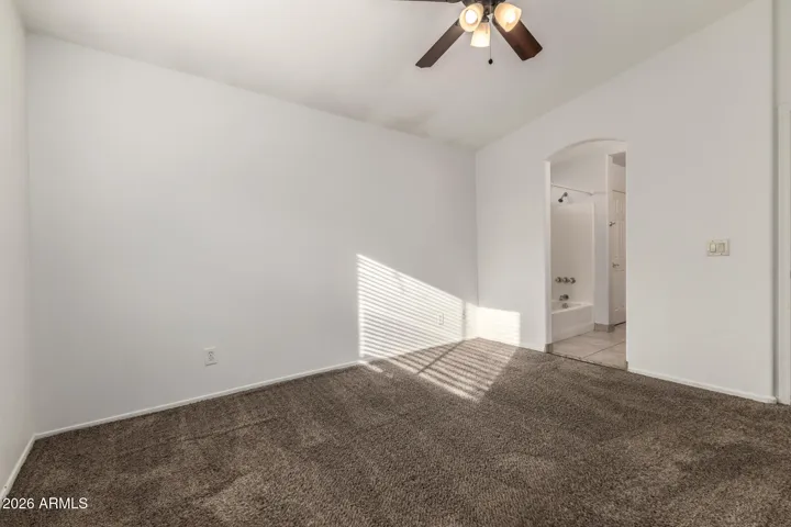 Primary Bedroom with vaulted ceiling