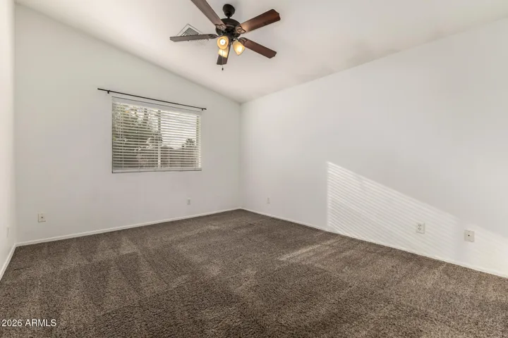 Primary Bedroom with vaulted ceiling