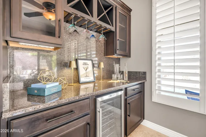 Custom extended cabinets with wine cooler - perfect for entertaining!