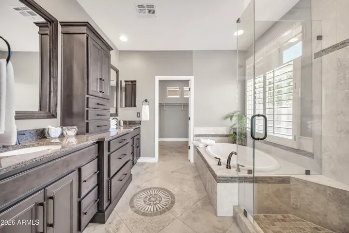 Gorgeous custom Thomasville cabinets and Travertine flooring