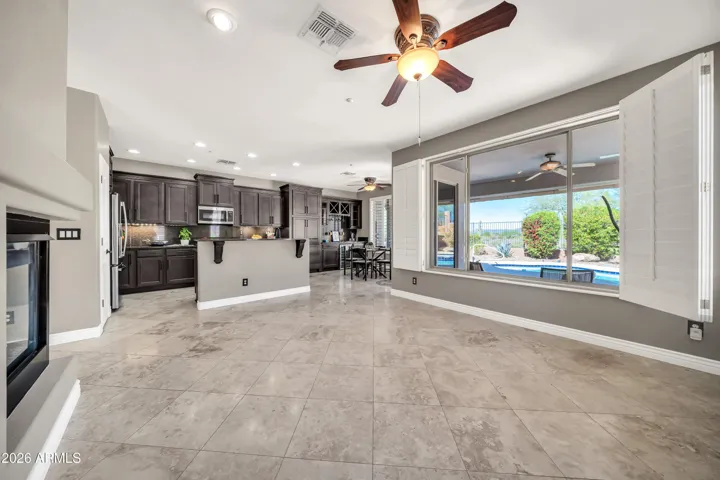 Family room with views of pool and distant Bradshaw Mountains