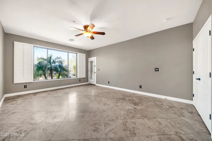 Primary suite with atrium door exit to covered patio and pool