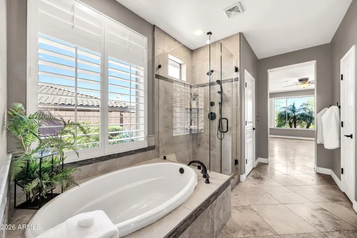 Amazing custom stonework in shower and tub surround