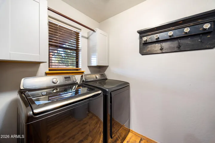 OFF KITCHEN AND COMES WITH WASHER/DRYER