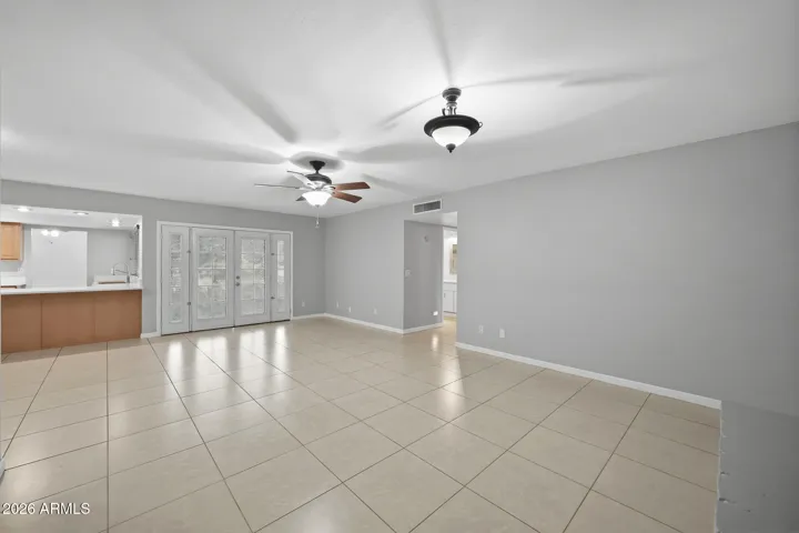 Hearth room view to guest bath, bedrooms 2 & 3 as well as french doors to back yard and kitchen