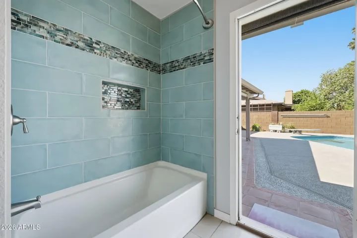 Exit to backyard and pool from Hall/Guest bath