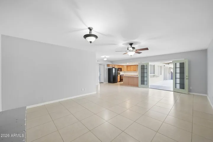 View from corner of hearth room towards kitchen and french doors to the back yard