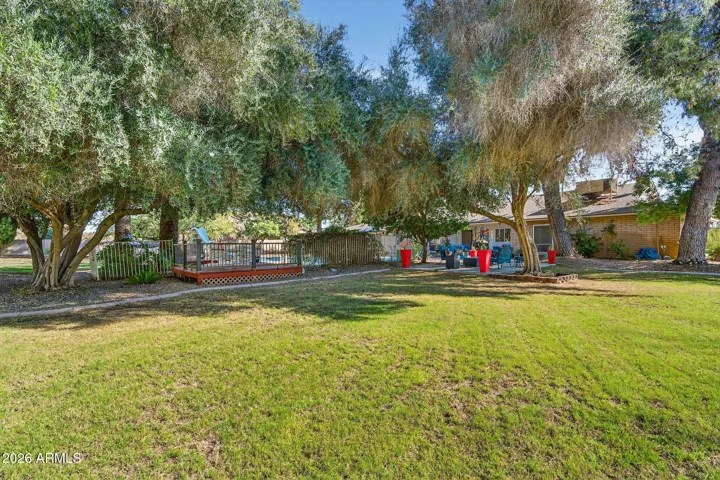 Expansive green lawn and beautiful mature trees. Low cost flood irrigation to keep everything green just $250/YEAR