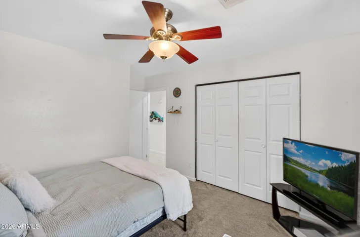 The fourth bedroom has a ceiling fan, and a closet organizer as well.