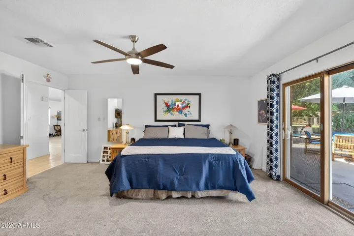 Of course there's a ceiling fan! Ceiling fans throughout this home!
