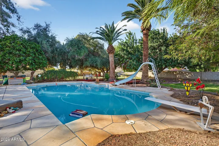 This 20x40' pool has a diving board and slide, along with a vacuum cleaning system