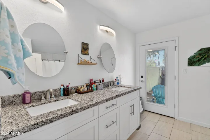 Another Full guest bath, this one with custom cabinets, granite, dual sinks and a full bath/shower.