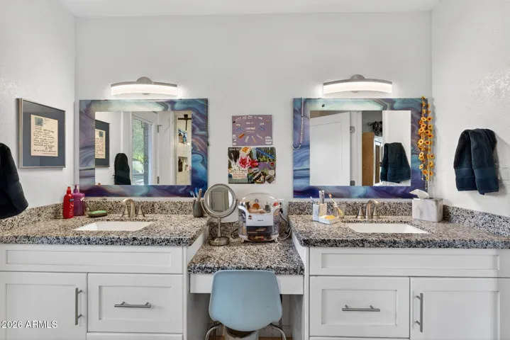 Custom cabinetry and granite match through the house. Note the built in make up area.