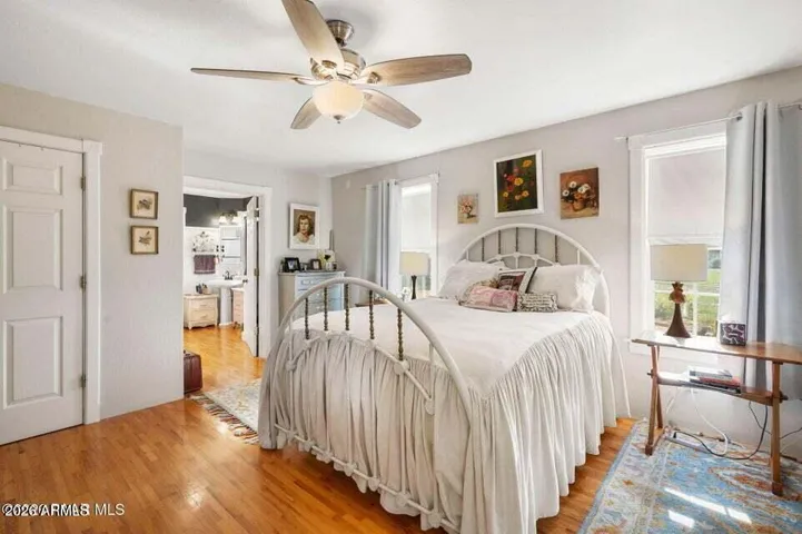 Oak Flooring Carries into Primary Bedroom.