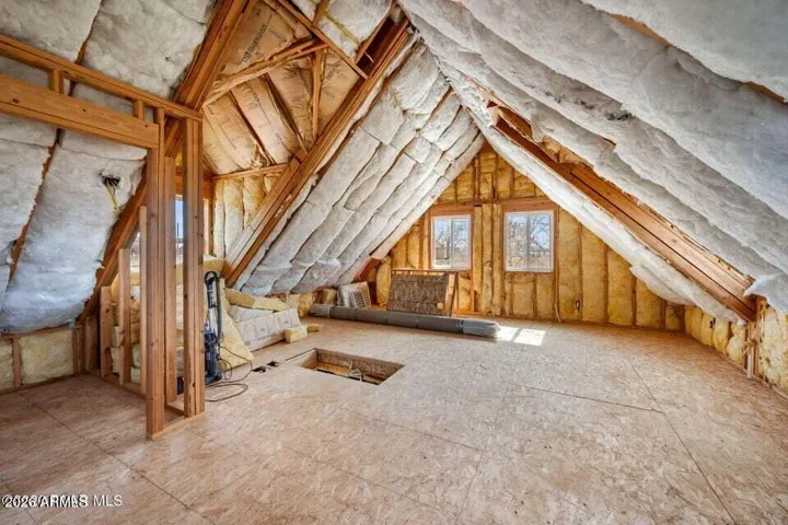 Above the garage area, wired and framed for more living space.