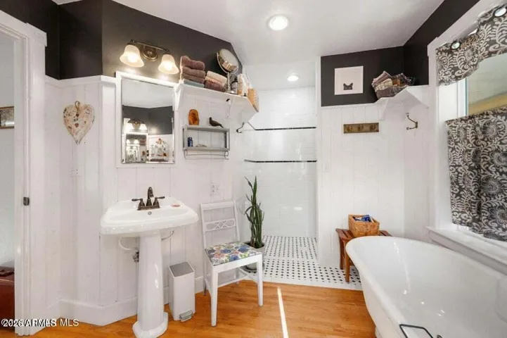 Work of Art- Clawfoot Tub, Custom Tiled Walk In Shower.